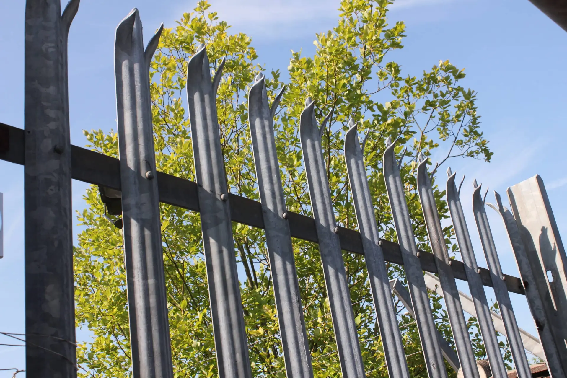 Heavy-duty palisade fencing securing an industrial property